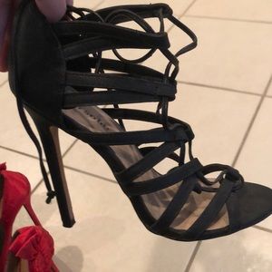 Black strappy high heels.